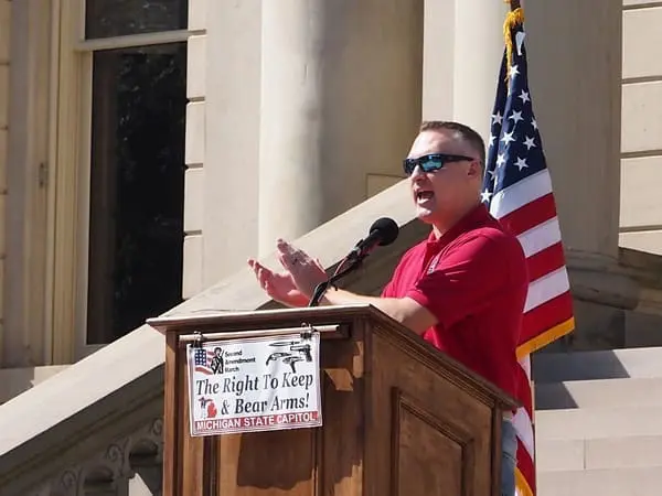 Michigan gun rights advocate and Legislative Director for Michigan Open Carry Tom Lambert speaks at a Second Amendment March event outside the Michigan Capitol Building on Sept. 19, 2024.