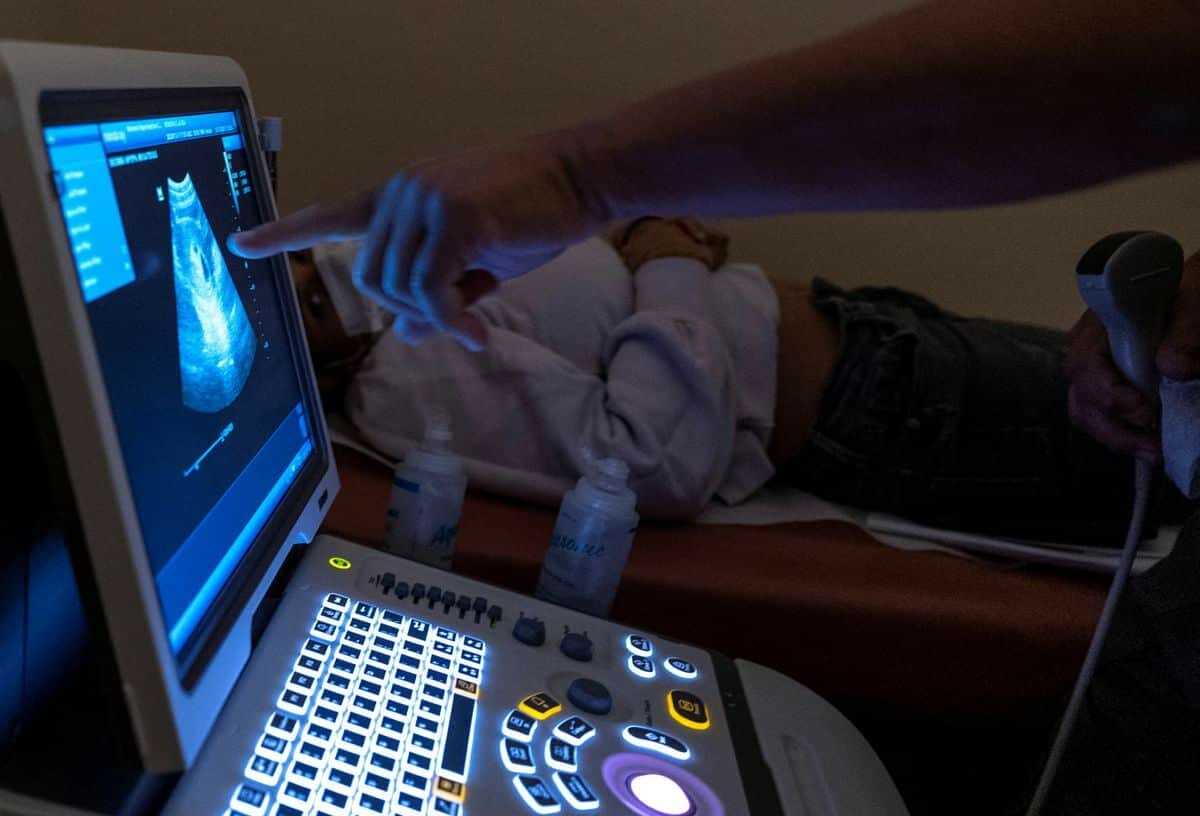 [4/7] Dr. Franz Theard, looks at a patient's sonogram at his abortion clinic, Women's Reproductive Clinic of New Mexico in Santa Teresa, U.S., January 13, 2023.