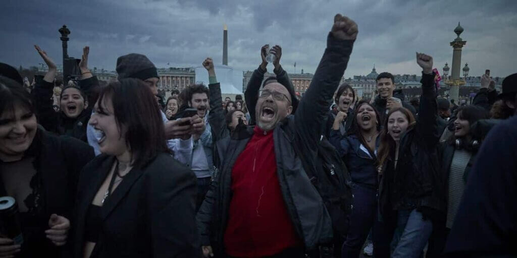 Demonstrators gather near the National Assembly to protest after French Prime Minister Elisabeth Borne delivered a speech to announce the use of the article 49.3, a special clause in the French Constitution, to push the pensions reform bill through the lower house of parliament without a vote by lawmakers, in Paris, France, March 16, 2023.