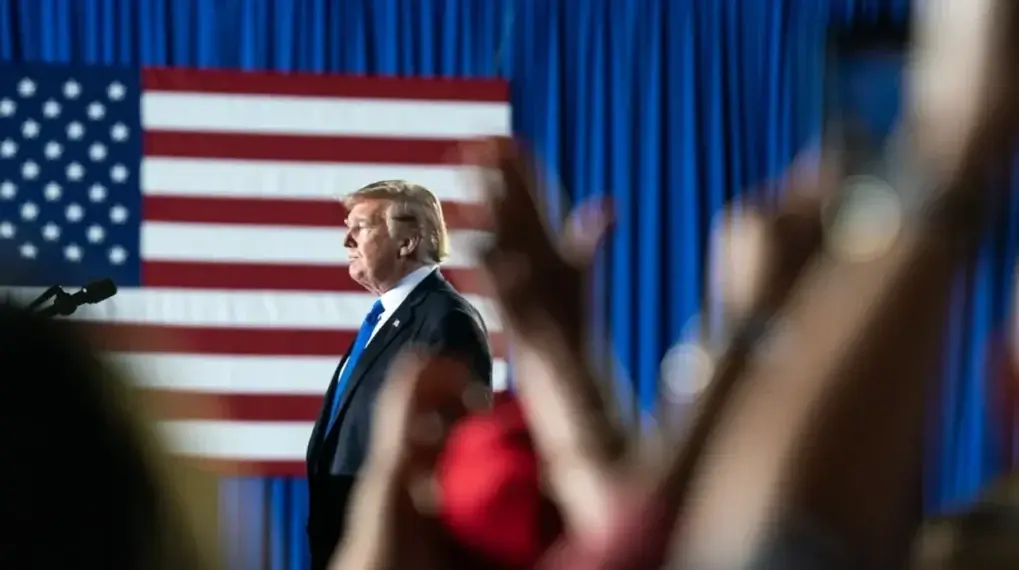 Donald trump with american flags in the background