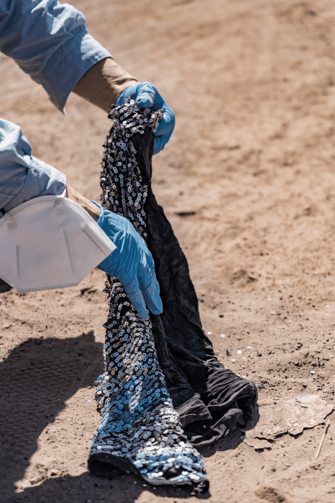 Pulling clothing out of sand