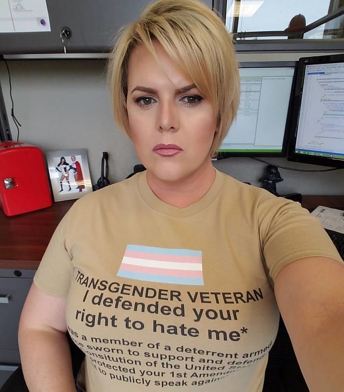Trans veteran wearing a shirt that says I fought for your right to hate me