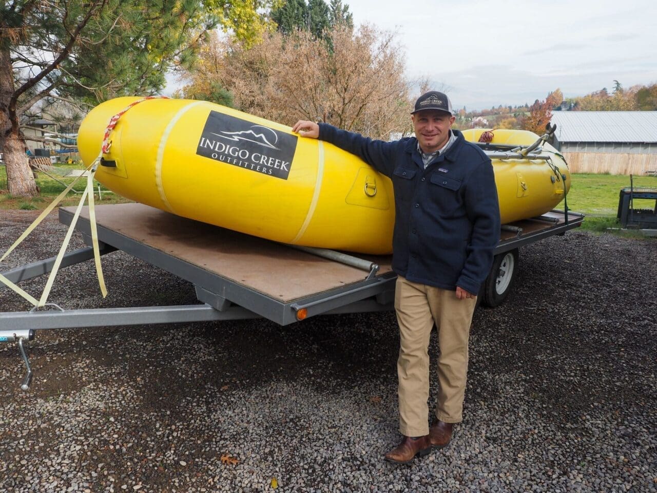 William volpert stamding beside a yellow raft