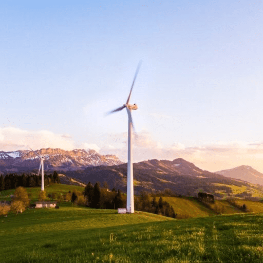 Wind turbines with mountains in the background 