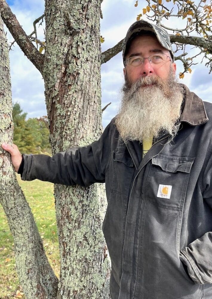 An mvp protestor standing by a tree