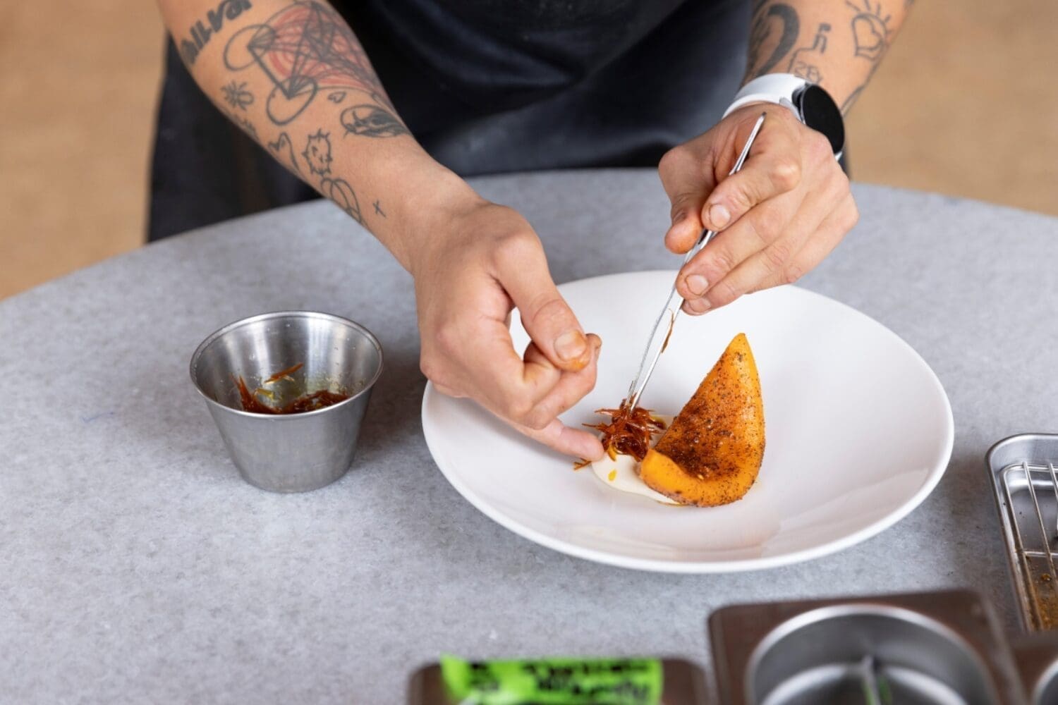 A chef plating a meal