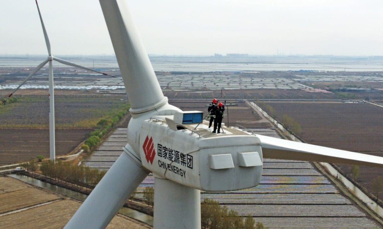 Technicians working on a wind turbine in China.