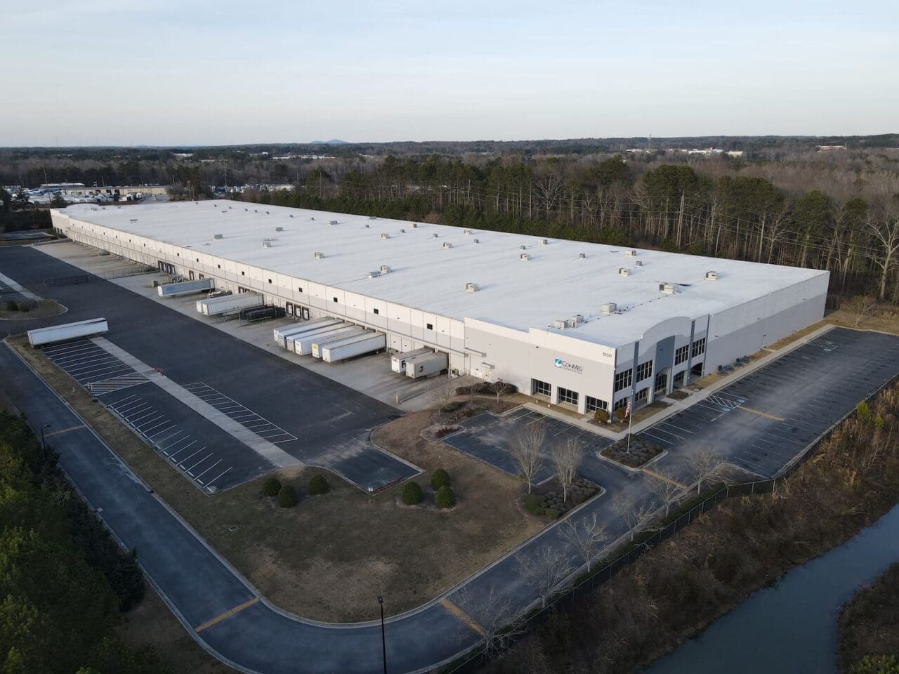 Aerial view of a factory with ambulances parked outside