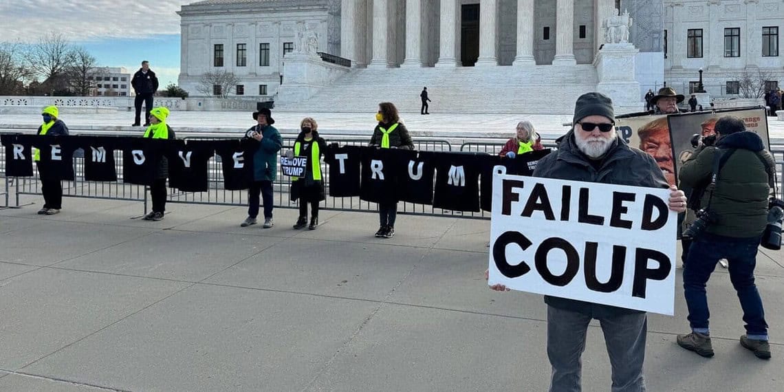 A man protesting trump in front of the supreme court