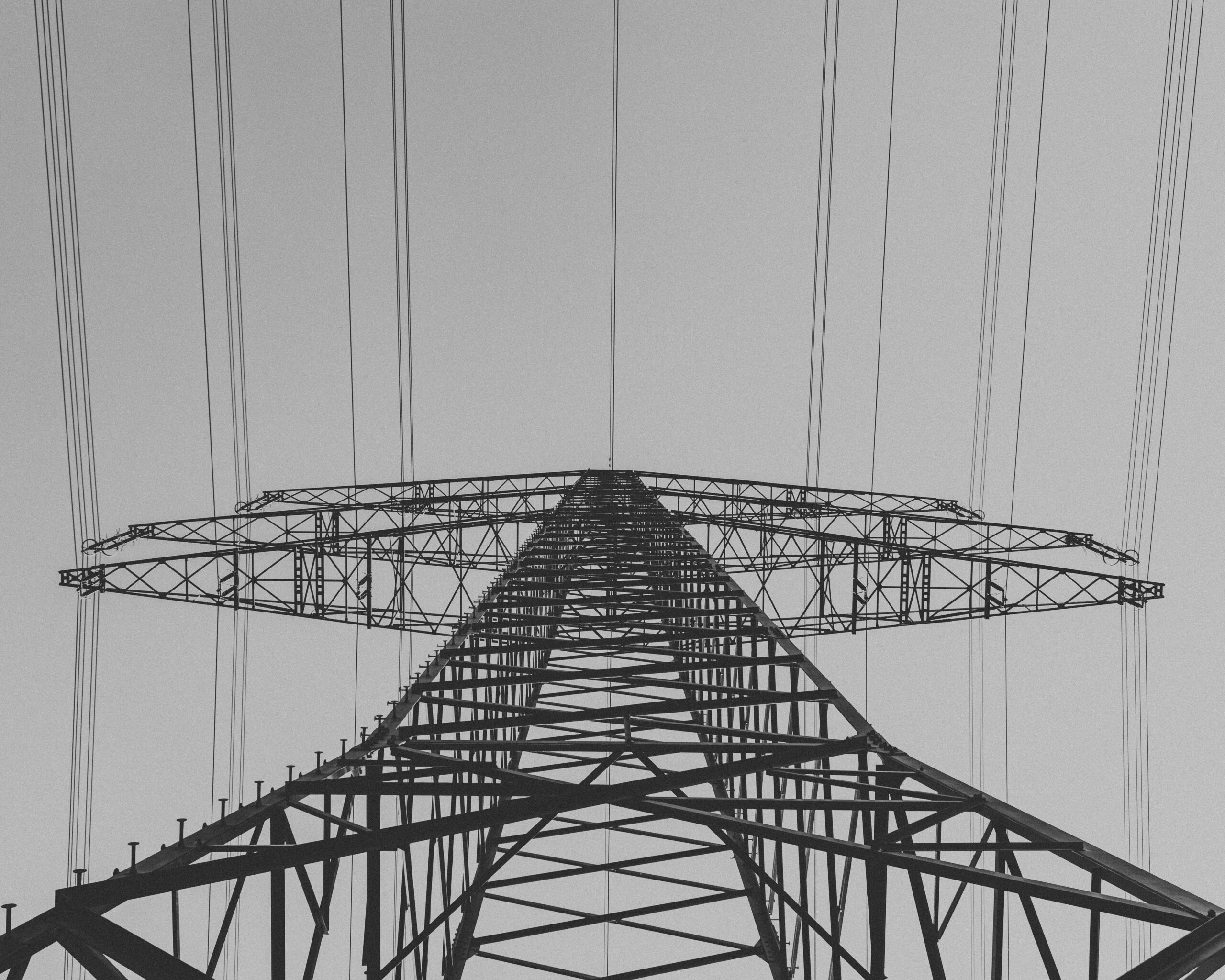 An view from below an electric transmission tower