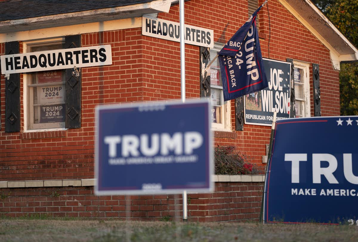 A house with Trump signs in the yard and all over the jouse