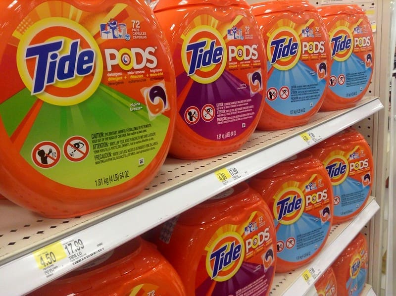 Tide laundry detergent pods on a store shelf.