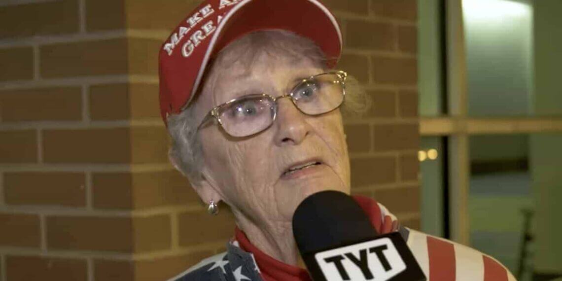 An elderly trump supporter with a shocked look on her face.