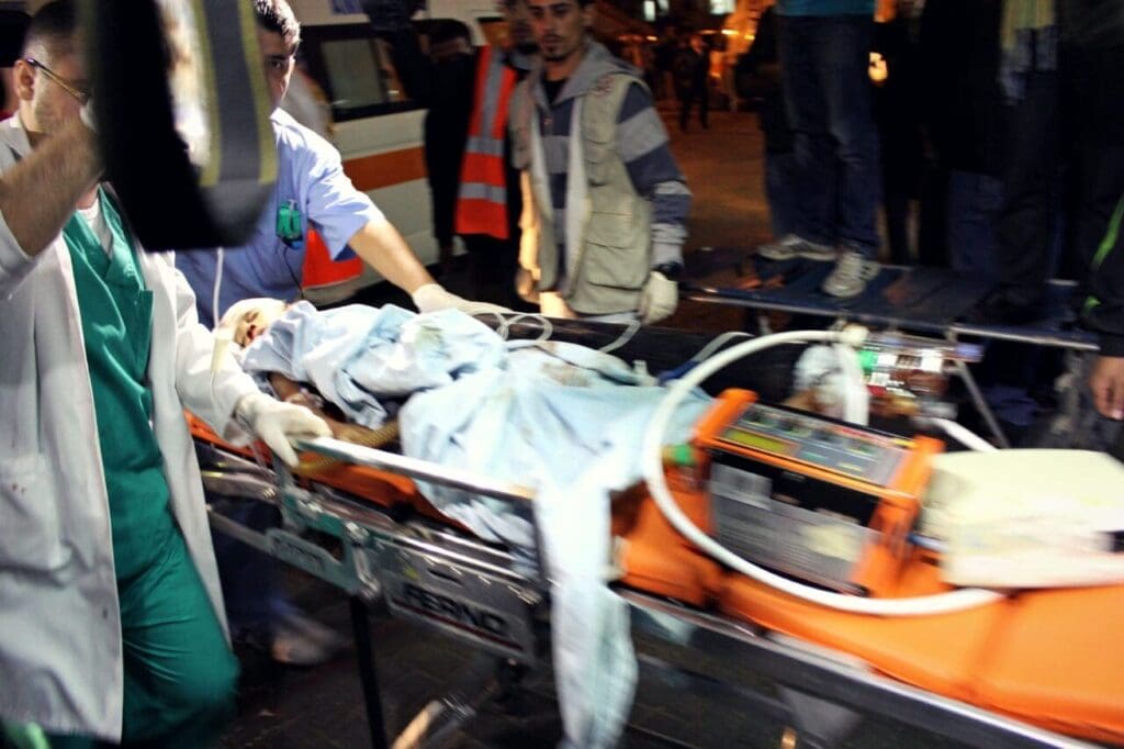 A baby being rushed into Shifaa hospital in Gaza