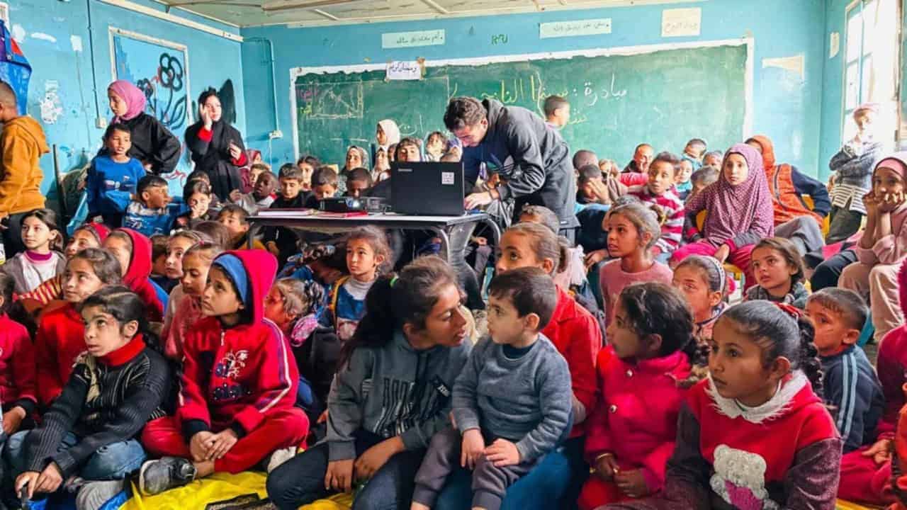 Kids in gaza watching a movie