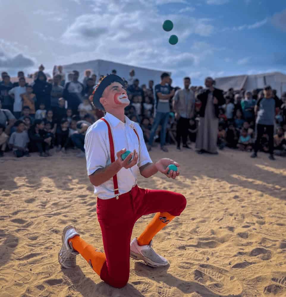 A clown performs for a groupif children in gaza