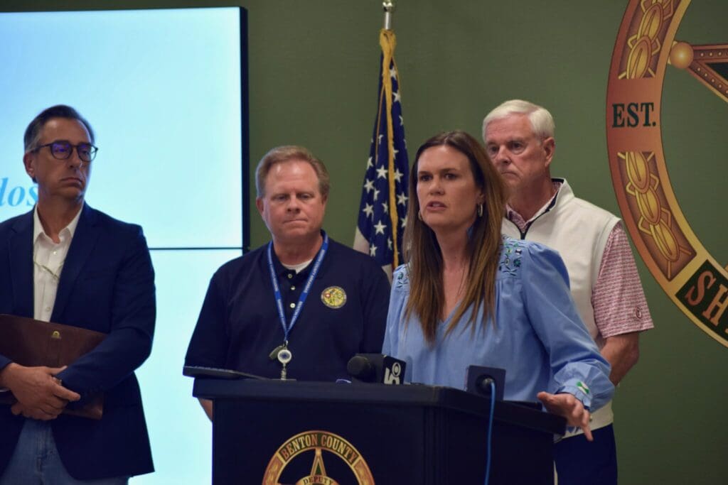 Severe weather: Gov. Sarah Huckabee Sanders, flanked by Arkansas Division of Emergency Management Director A.J. Gary, Benton County Judge Barry Moehring and U.S. Rep. Steve Womack, provides an update on storm damage during a press conference on May 26, 2024 at the Benton County Sheriff’s Office.