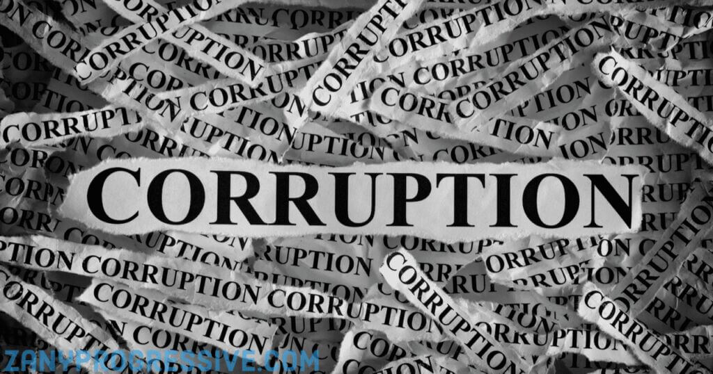 Torn up pieces of paper in a pile with the word corruption printed on them
