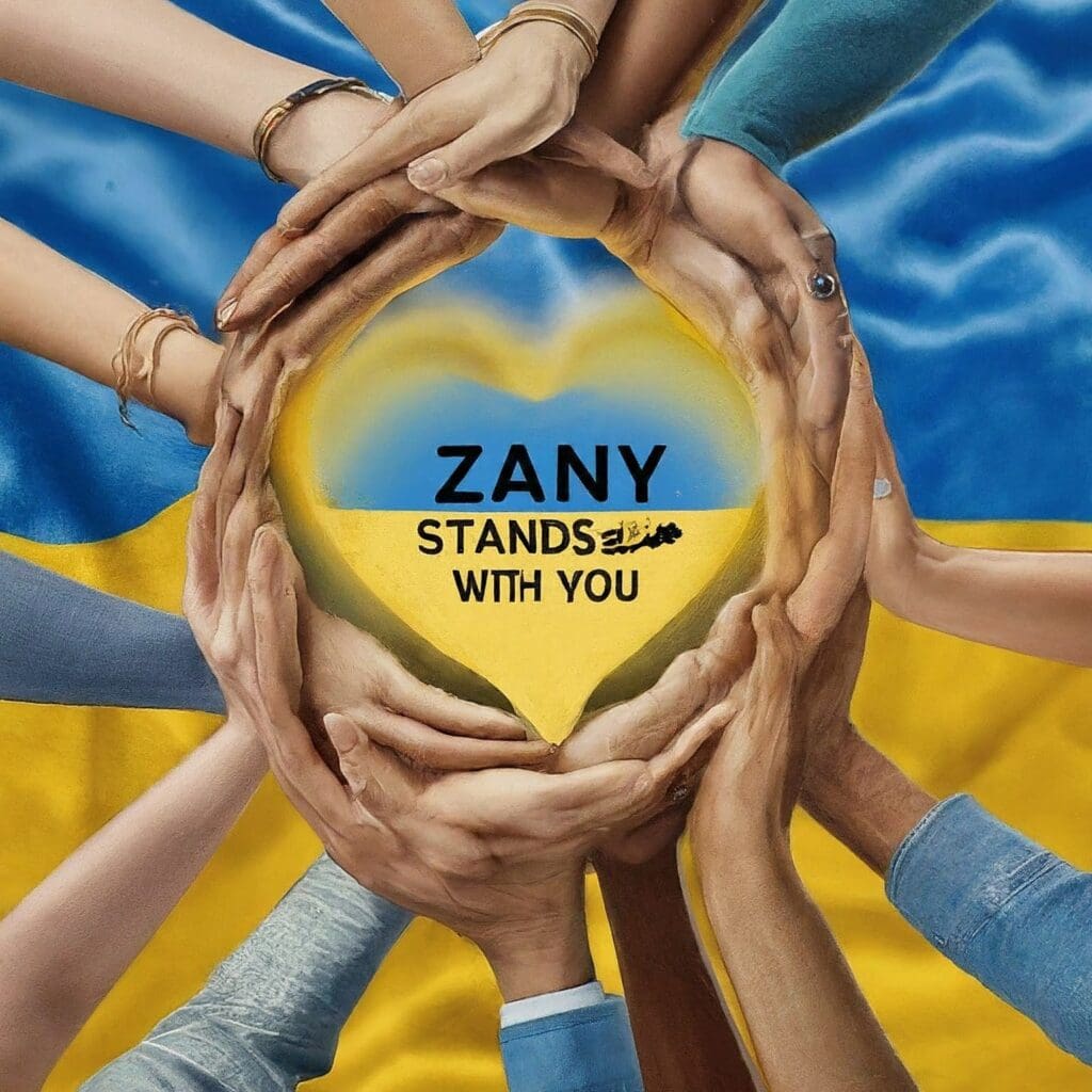 Ukraine war: hands surround a blue and yellow heart with text: Zany stands with you” against backdrop of the Ukrainian flag.