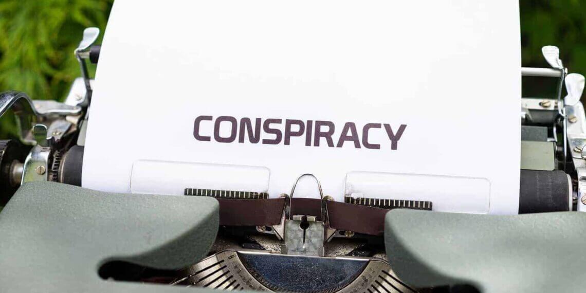 Conspiracy theories a typewriter with a piece of paper in it has conspiracy typed on it.