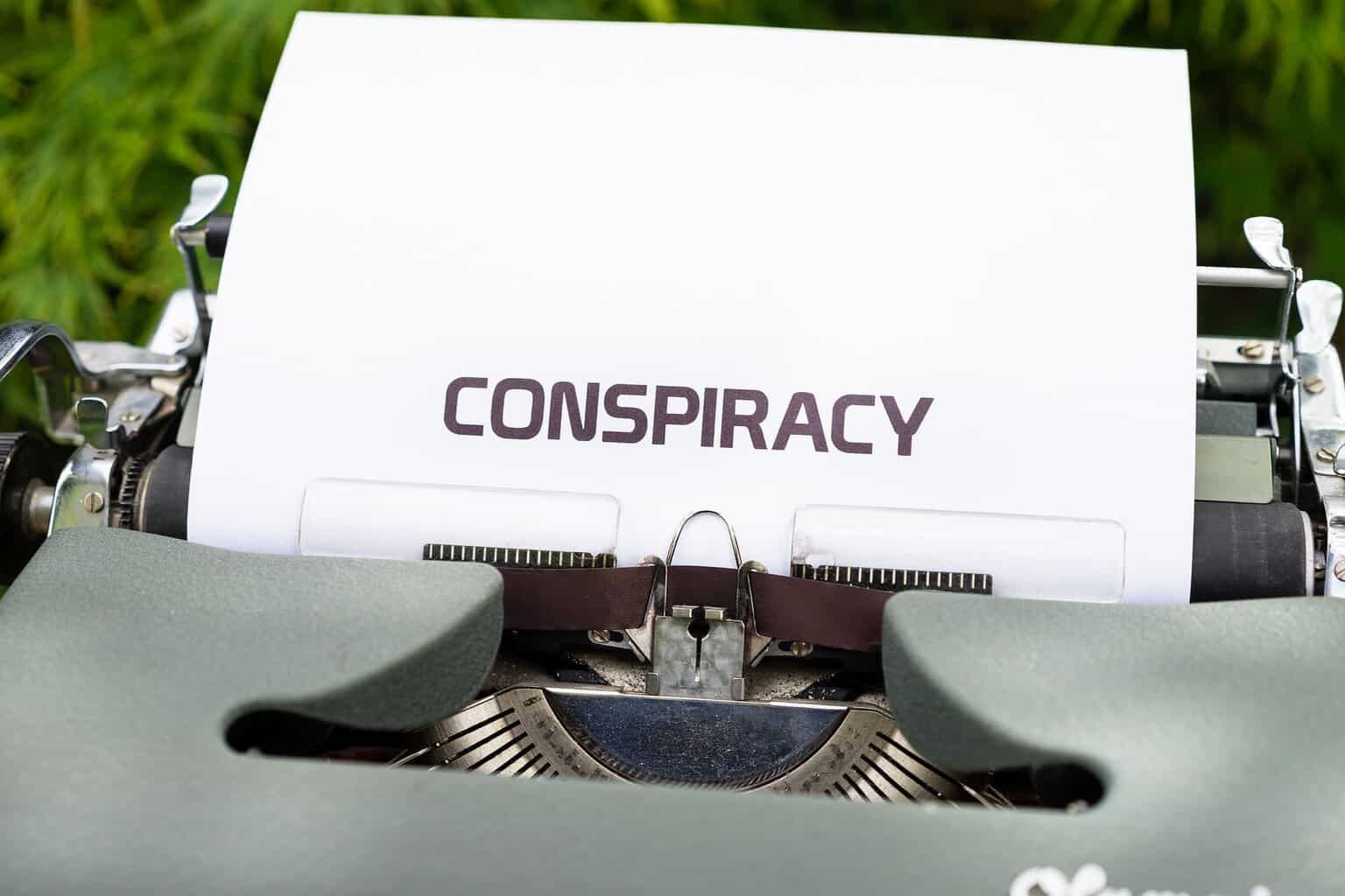 Conspiracy theories a typewriter with a piece of paper in it has conspiracy typed on it.