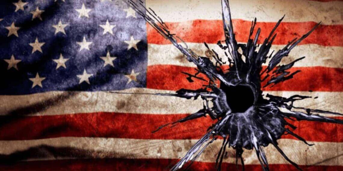 Image of the american flag with a bullet hole in it