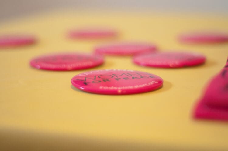 CODEPINK’s buttons that say “Women for peace”
