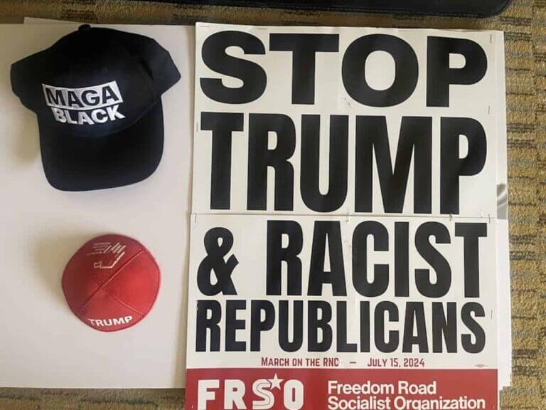 Sign that says stop trump and racist republicans