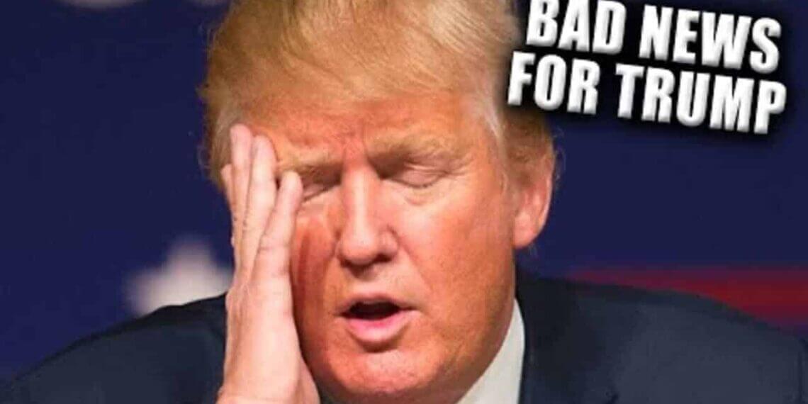 Donald trump with his head in his hand, eyes closed