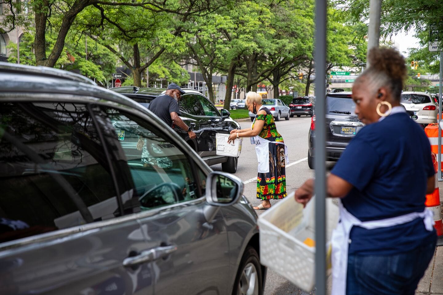 Michigan votes Election workers collect absentee ballots from voters during early voting for the August primary in Detroit on July 29, 2024.