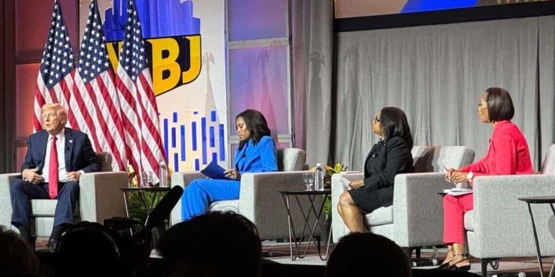 Donald trump on stage at the nabj conference