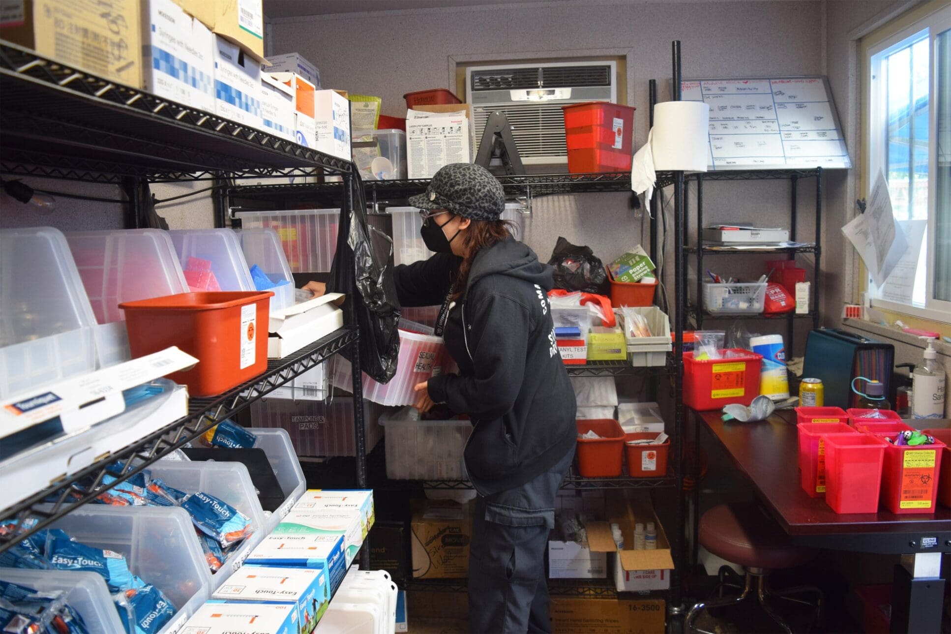 HIV Latinos: A medical clinic worker in a supply closet