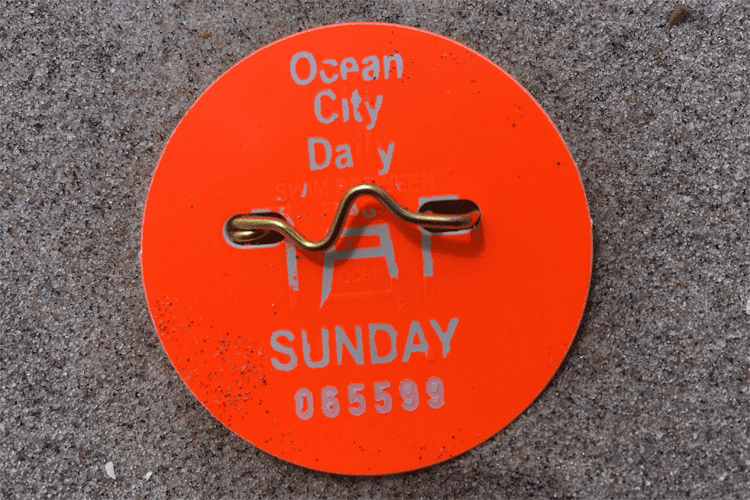 A beach badge from Ocean City, New Jersey, that gives people access to the beach.