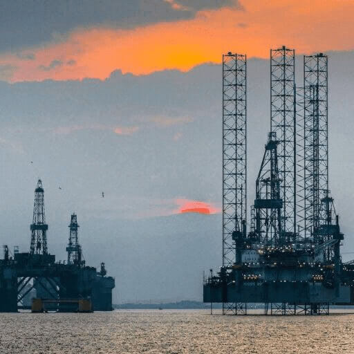 Good news oil rigs with the setting sun in the background