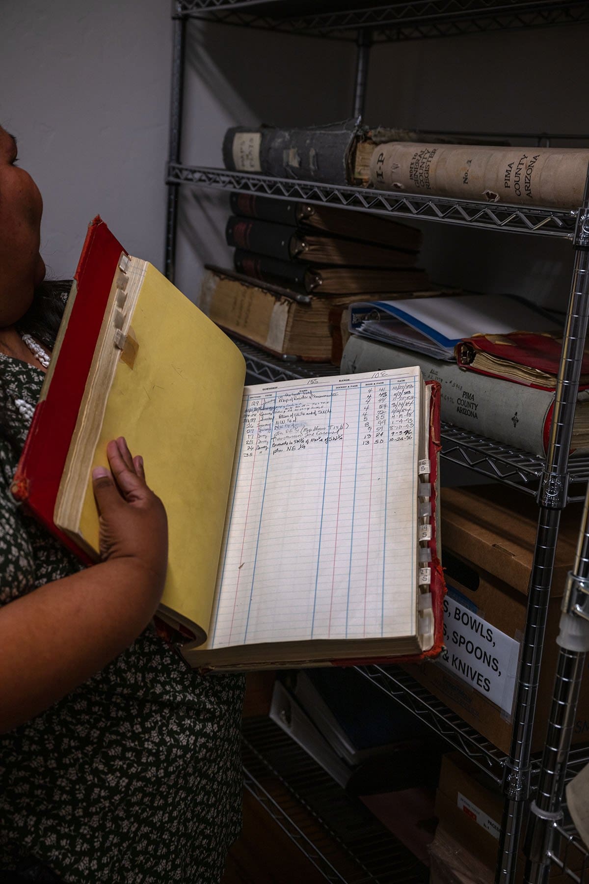 Native American Gabriella Cázares-Kelly goes through old Pima County records at her offices in Tucson, Arizona.