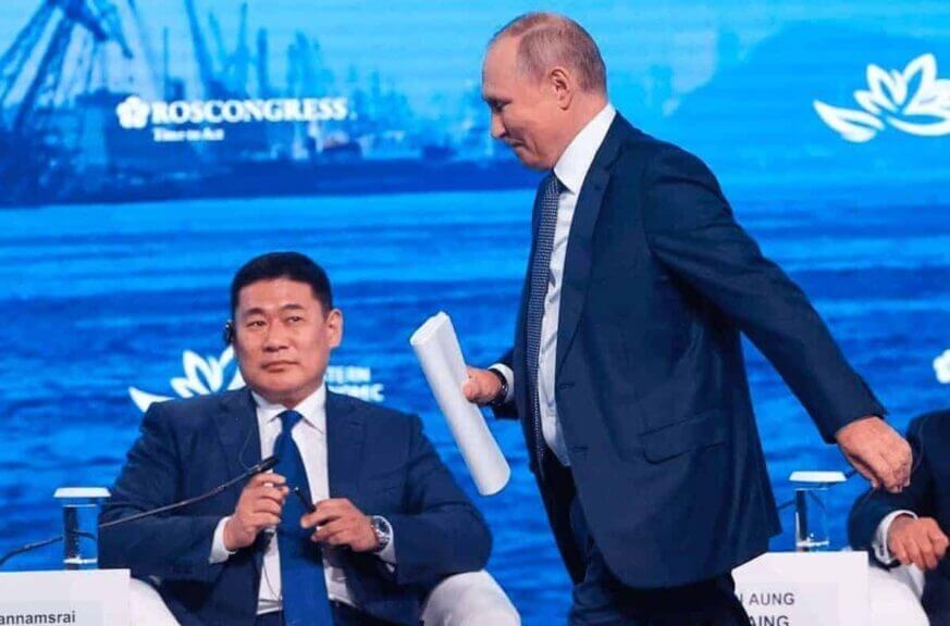 Russian president vladimir putin walks past mongolia’s prime minister, luvsannamsrain oyun-erdene.