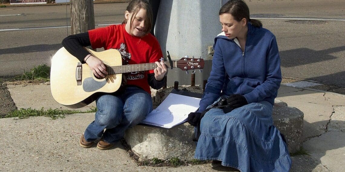 Women sing at a protest against the overturning of roe v wade