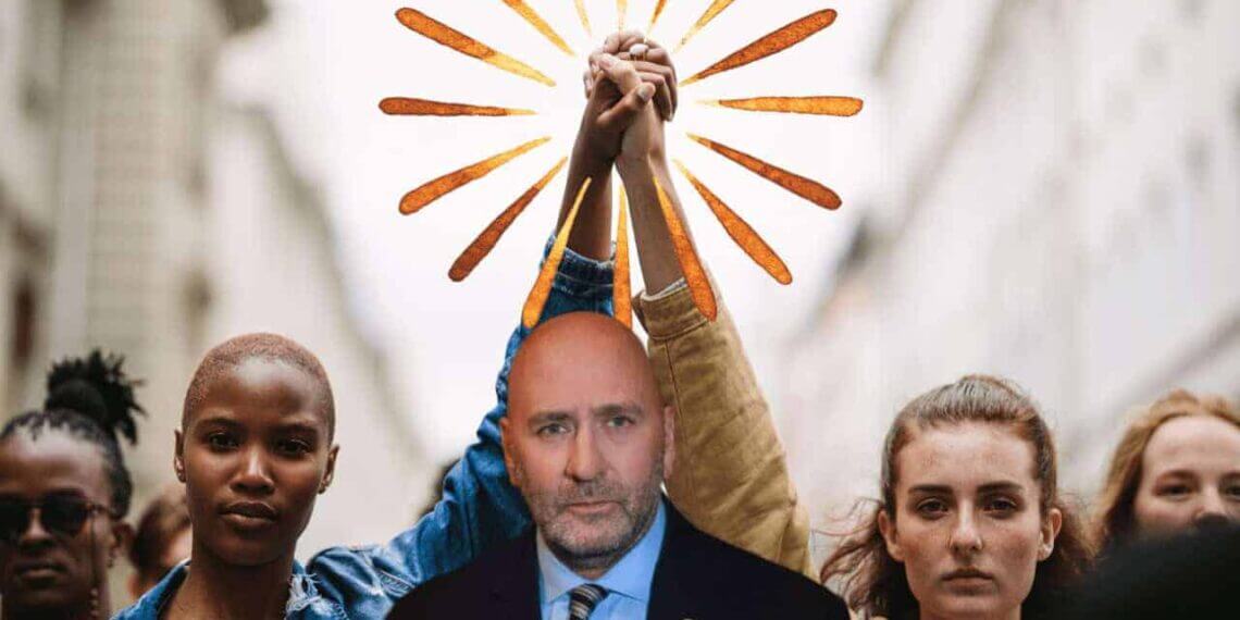 Representative clay higgins in front of 2 women with arms raised, holding hands—one white, the other black.