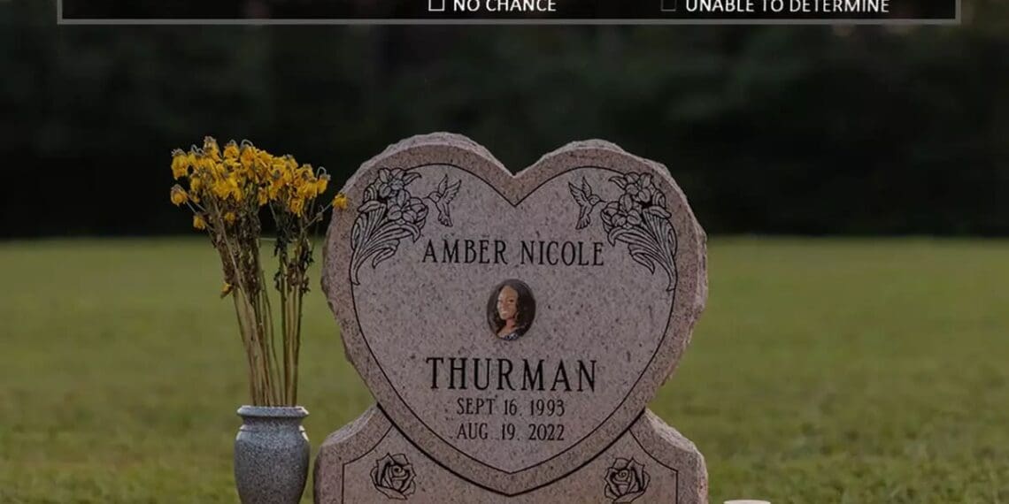 The headstone at amber thurman’s gravesite adorned with her photo, above it is the report from the maternal mortality board that investigated her death on top of the image.