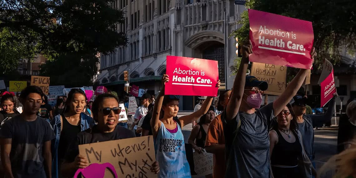 Thousands of people walk in a march in support of abortion rights near downtown san antonio