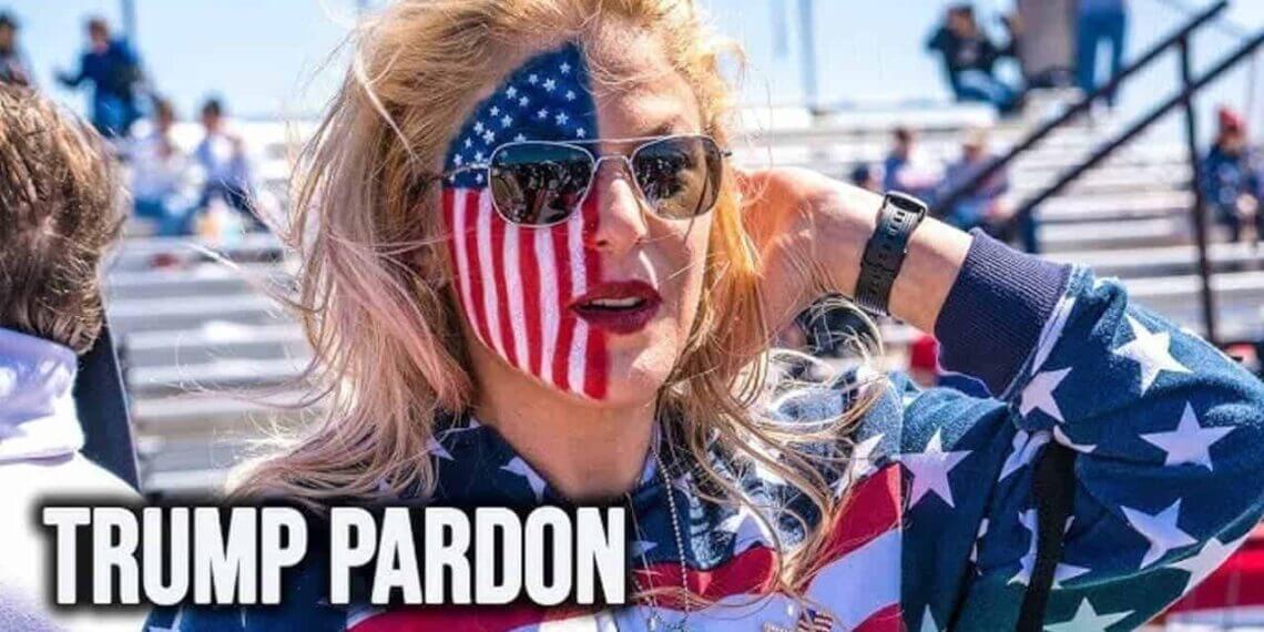 A trump supporter with half of her face painted as an american flag