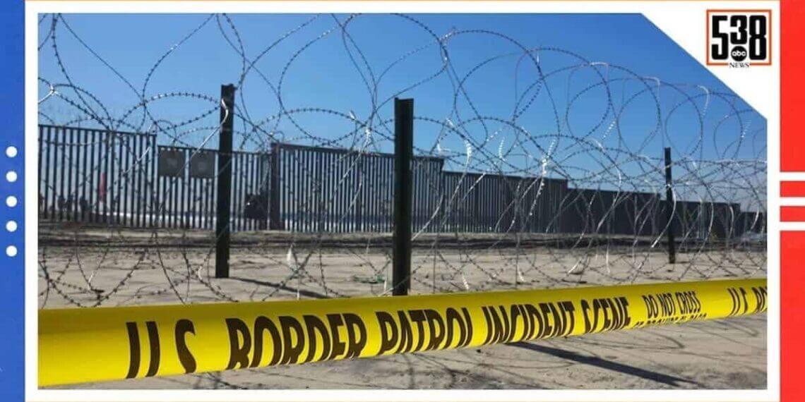 The southern border wall and barbed wire