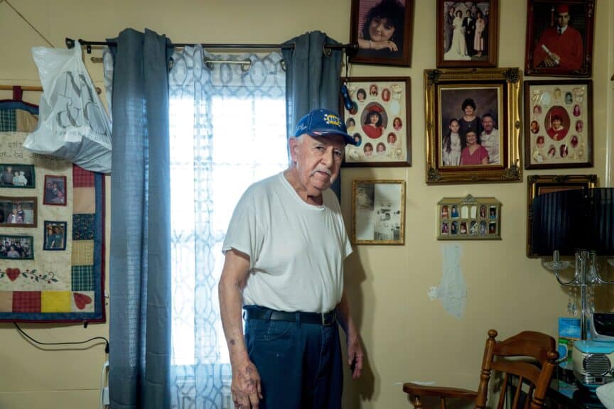 2024 in photos an elderly gentleman standing in his living room.