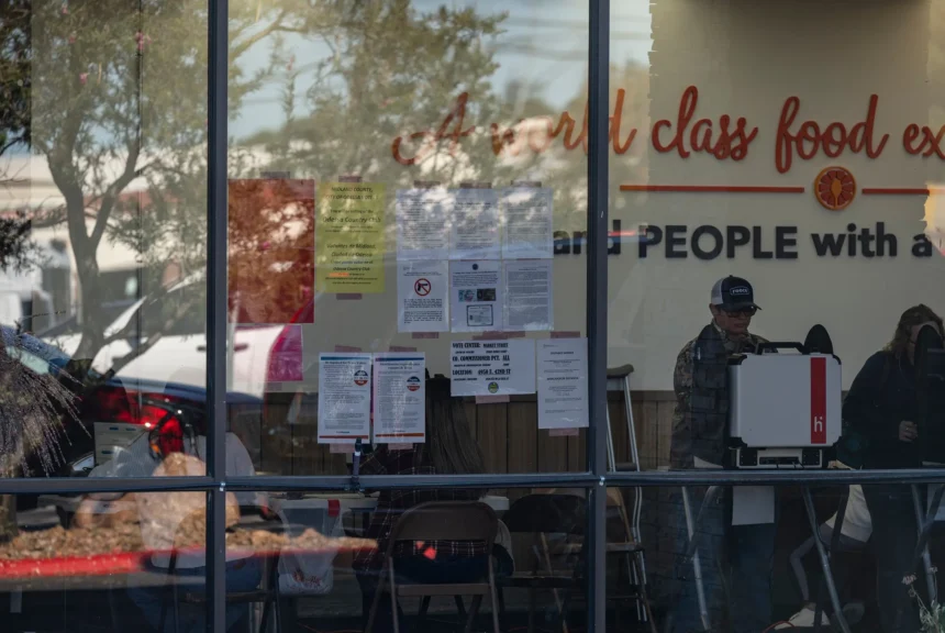 Ector county residents cast their vote at a polling location inside a market street grocery store on election day in odessa.