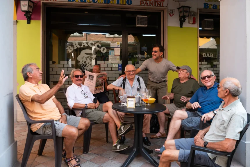 Cardiologist paolo pattoneri runs into several of his patients that see him at the community health clinic in san secondo parmense outside parma, italy.