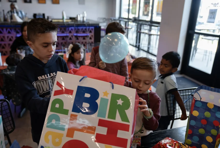 August opens birthday presents