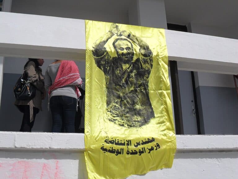 A flag with marwan barghouti pictured on it