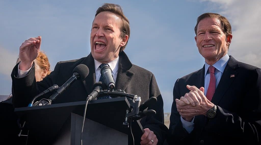 Senator chris murphy speaks in front of the capitol