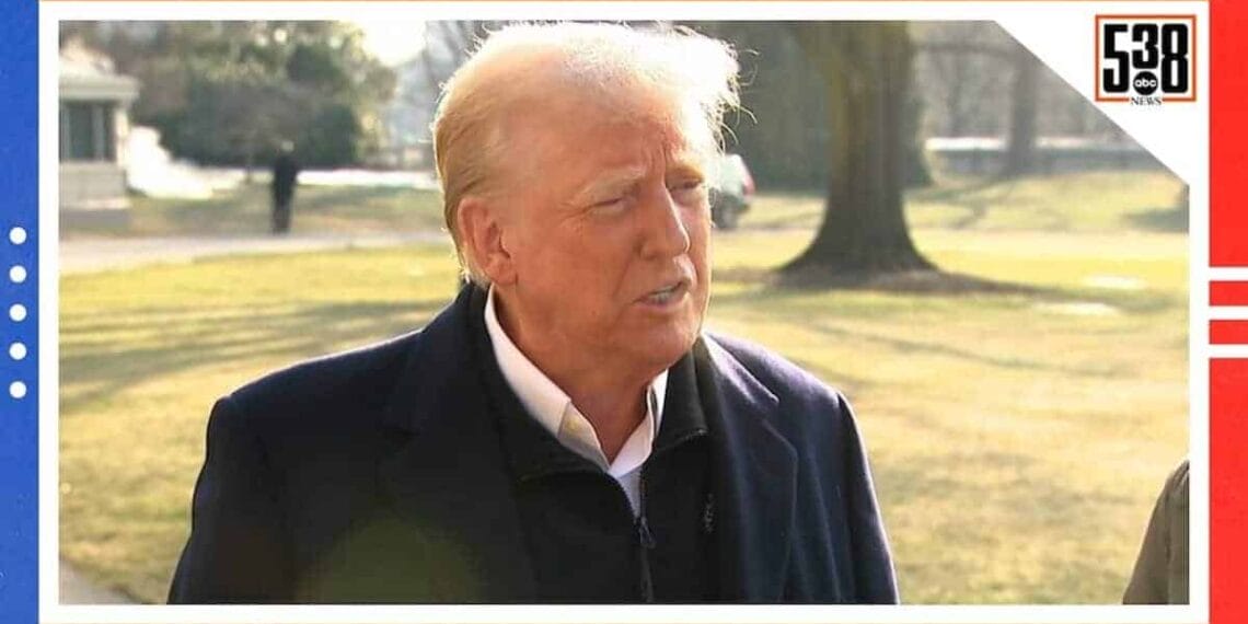 Donald trump speaking to a reporter outdoors