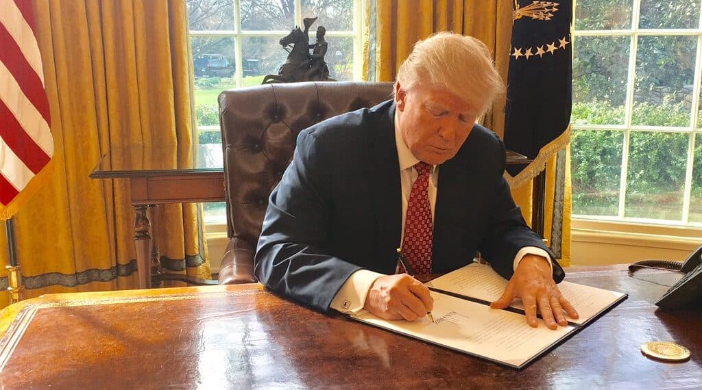 Donald trump signing an executive order